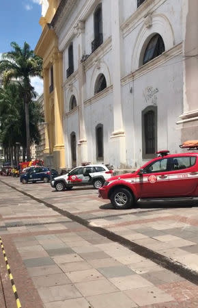 Emergency services are seen outside of Campinas Cathedral in Campinas, Brazil December 11, 2018 in this still image taken from a video obtained from social media. NATALIA PIASSENTINI/via REUTERS