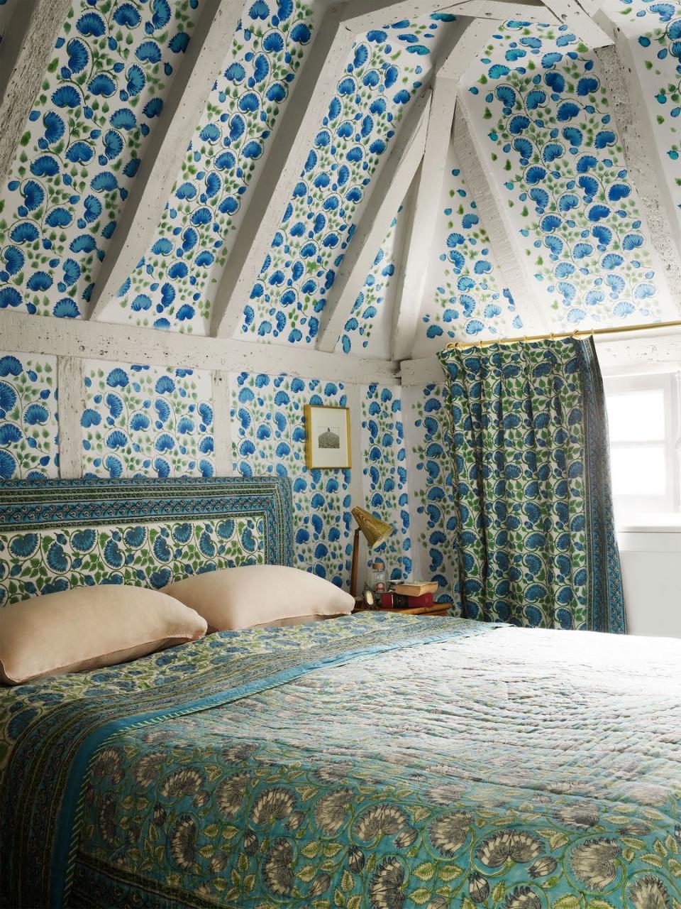 boho bedroom with ceilings and walls stenciled with pochoir technique