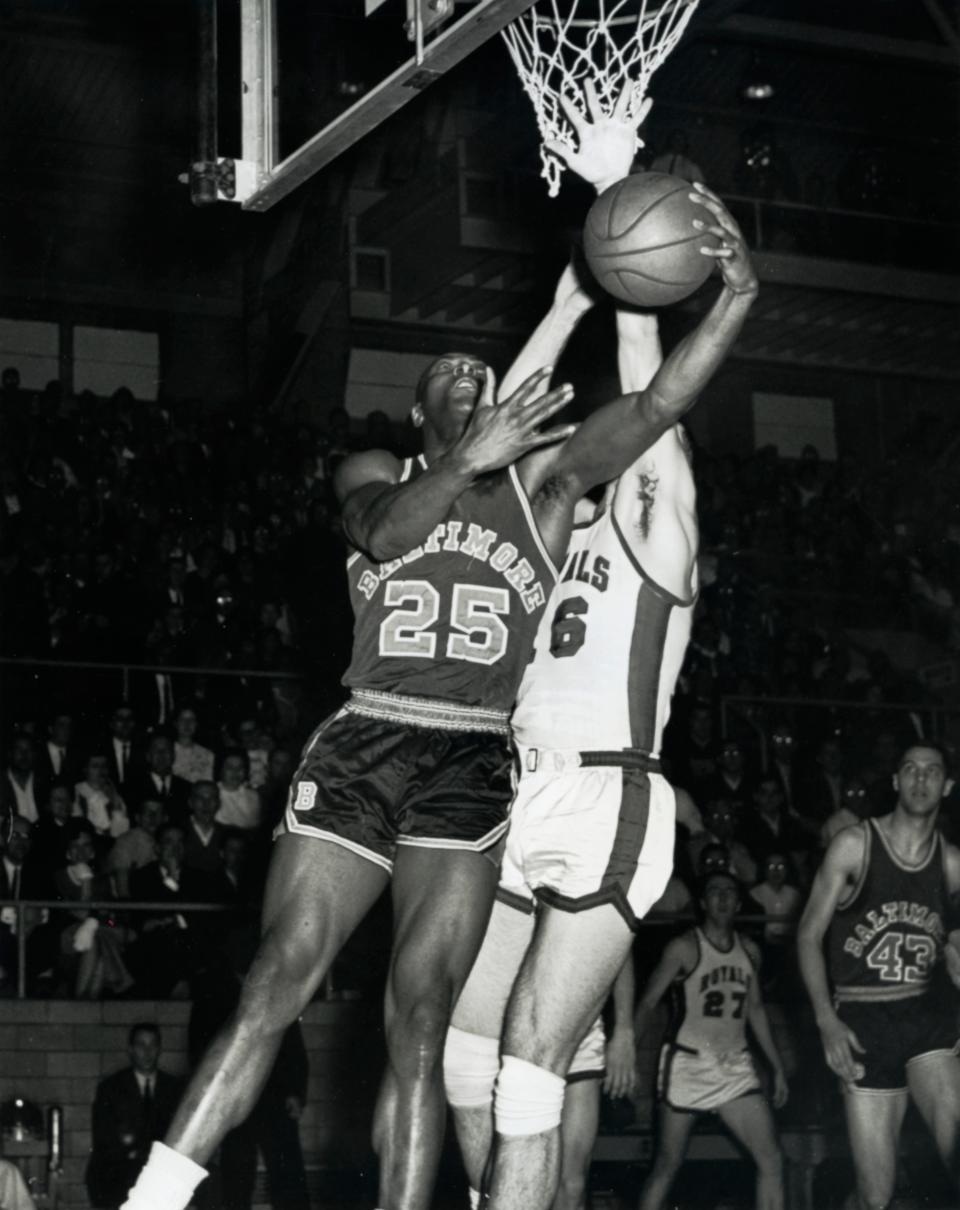 Baltimore Bullets forward Gus Johnson (25) is defended by Cincinnati Royals forward Jerry Lucas (16). Credit: Malcolm Emmons-USA TODAY Sports