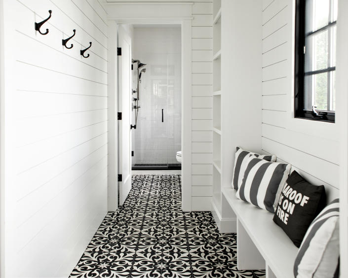 <p> It&#x2019;s not unusual to want to make a small hallway space feel bigger. This corridor, in a house with interiors designed by&#xA0;Marlaina Teich, shows not only how lighter colors are a great way to help make the space feel brighter, but that a little optical illusion goes a long way.&#xA0; </p> <p> White shiplap arranged in horizontal lines creates a sense of distance between one end of the hallway and the other, as they disappear towards a vanishing point. This makes the space feel both longer and grander.&#xA0; </p>