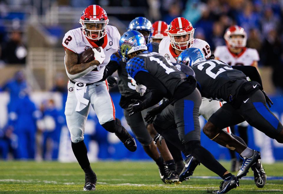 Georgia running back Kendall Milton (2) runs the ball during the third quarter against Kentucky at Kroger Field.