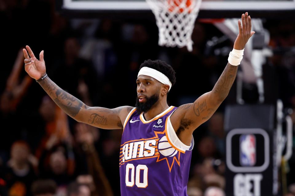 Royce O'Neale #00 of the Phoenix Suns reacts after a basket during the second half against the Sacramento Kings at Footprint Center on Feb. 13, 2024 in Phoenix.