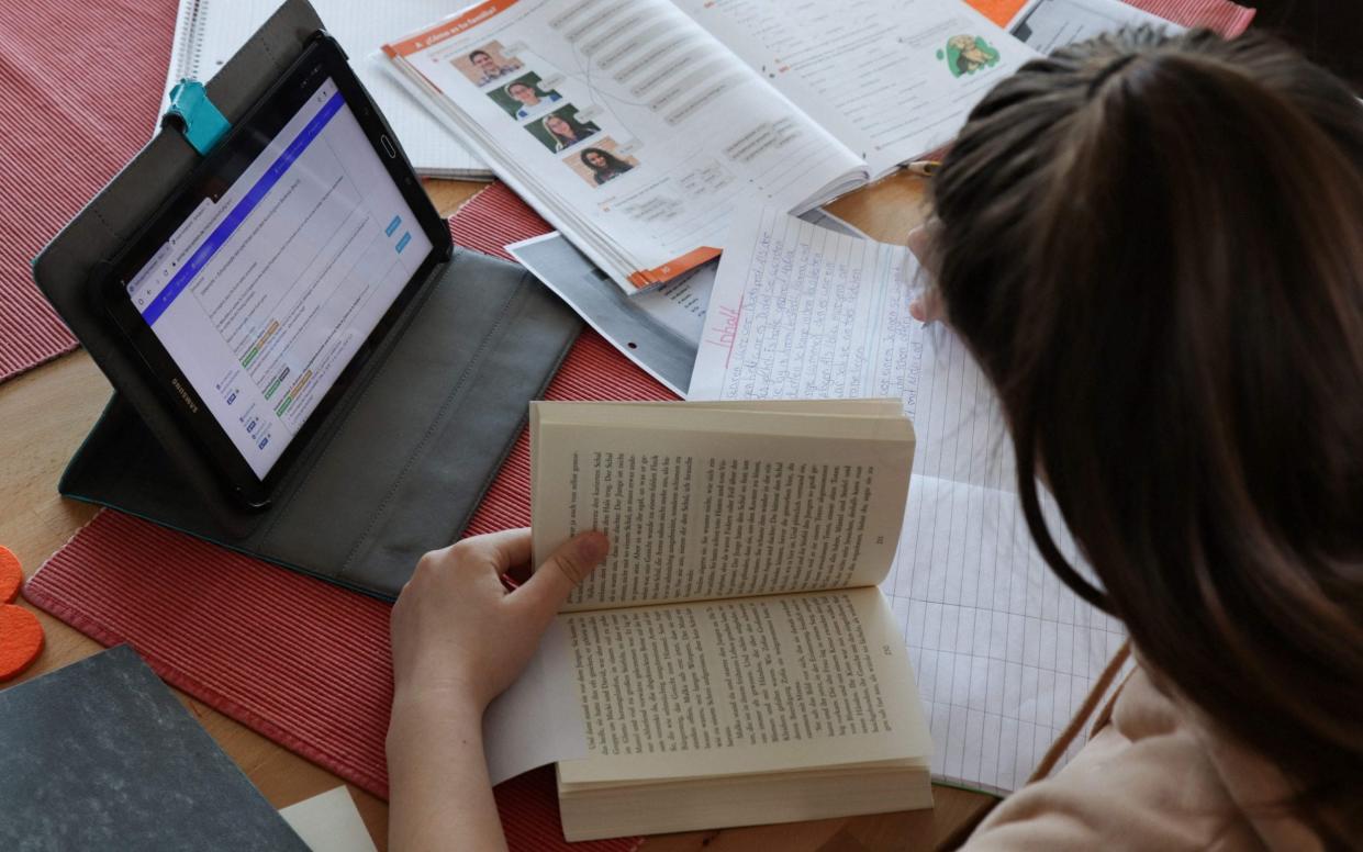 Schoool children pupils learning lost Covid pandemic earnings - Yann Schreiber/AFP via Getty Images