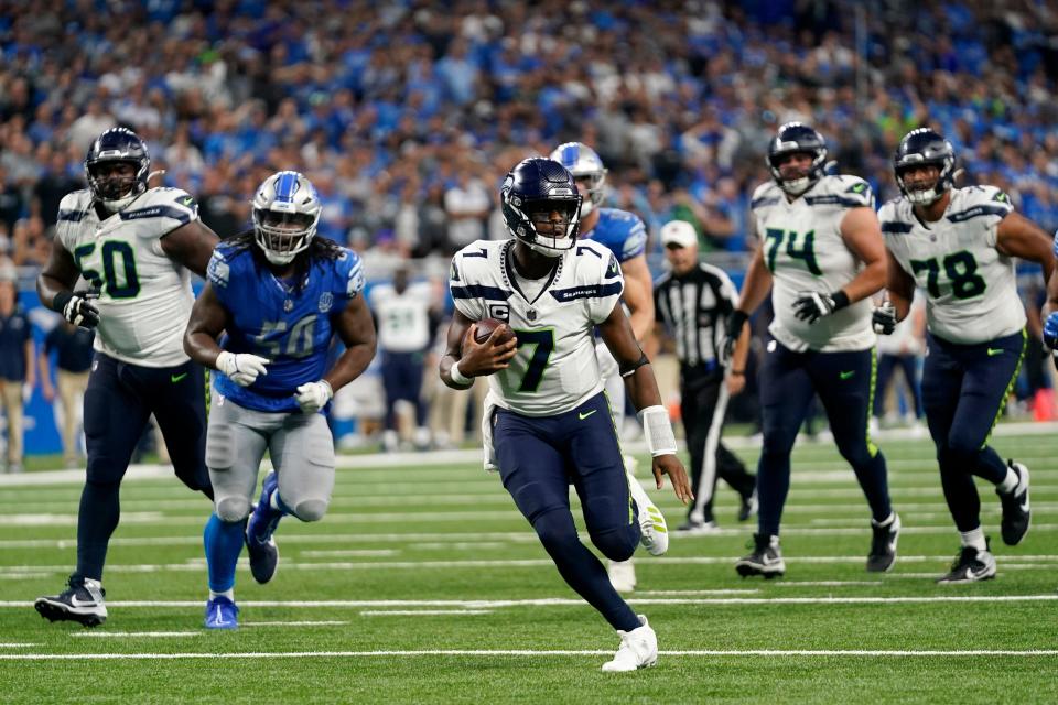 Seattle Seahawks quarterback Geno Smith (7) scrambles up field during the second half of an NFL football game against the Detroit Lions, Sunday, Sept. 17, 2023, in Detroit. (AP Photo/Paul Sancya)