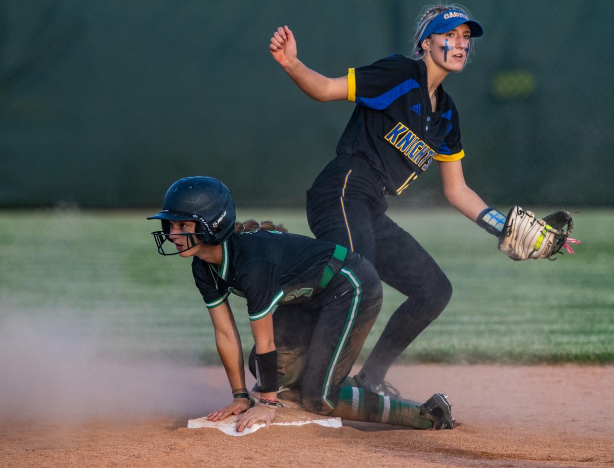 North’s Charleigh Hankins (3) slides to second in time before Castle’s Emma Bruggenschmidt (12) could strike her out in the 4A sectional championship at North High School, Saturday night, May 28, 2023.