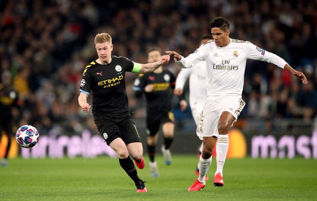 Varane (right) is set to partner Harry Maguire in defence for United 