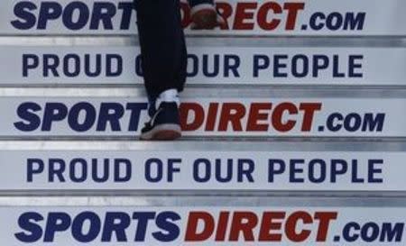 A worker walks up stairs before a Sports Direct general meeting to vote on the re-appointment of chairman Keith Hellawell in Shirebrook, January 5, 2017. REUTERS/Darren Staples