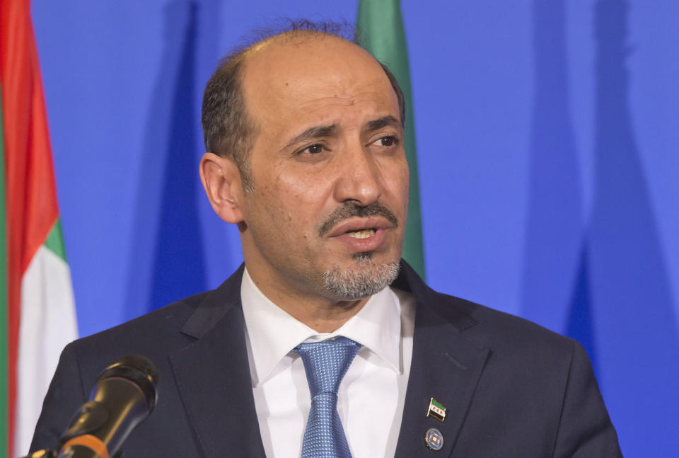 Syrian National Coalition Chief Ahmad al-Jarba, speaks during a press conference at the foreign ministry in Paris, Sunday, Jan. 12, 2014. The head of Syria’s main Western-backed opposition group says its international supporters agree that Bashar Assad has no future as the country’s leader. The statement Sunday from Ahmad al-Jarba comes as U.S. Secretary of State John Kerry and top envoys from 10 other countries raised the pressure for peace talks that would bring his Syrian National Coalition face-to-face with the government the rebels are trying to overthrow. (AP Photo/Michel Euler)