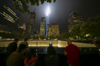 <p>A visitor takes a photo of the Tribute in Light on Sept. 11, 2018. (Photo: Gordon Donovan/Yahoo News) </p>