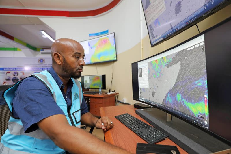 Khadar Sheikh Mohamed director of the new national disaster early warning centre designed to help Somalia predict disasters monitors the weather patterns, in Mogadishu