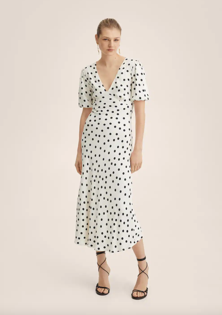 model in white and black Mango Polka Dot Satin-Finish Dress (Photo via Mango)