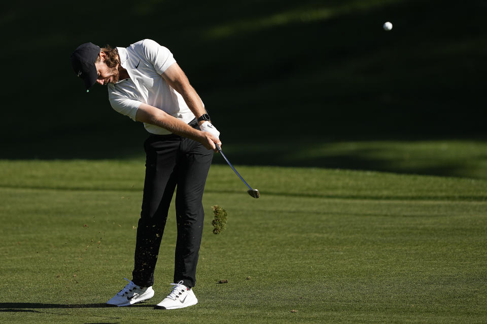 Tommy Fleetwood, of England, chips to the green on the 15th hole during first round of the Wells Fargo Championship golf tournament at the Quail Hollow Club on Thursday, May 4, 2023, in Charlotte, N.C. (AP Photo/Chris Carlson)