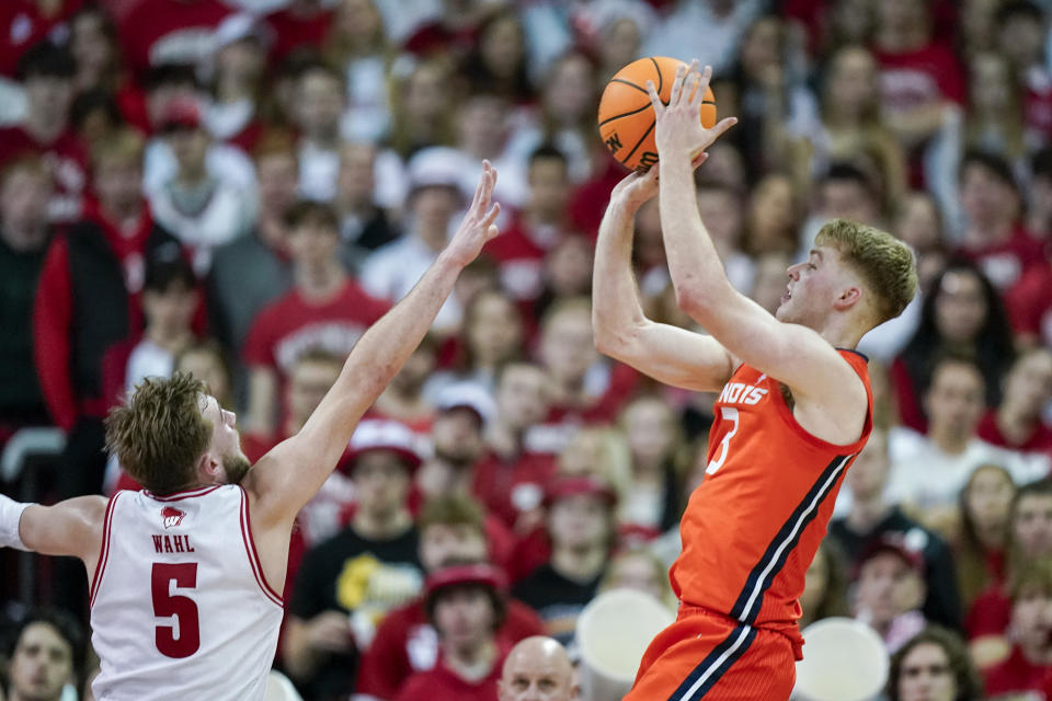 Illinois' Marcus Domask (3) shoots against Wisconsin's Tyler Wahl (5) during the second half of an NCAA college basketball game Saturday, March 2, 2024, in Madison, Wis. (AP Photo/Andy Manis)