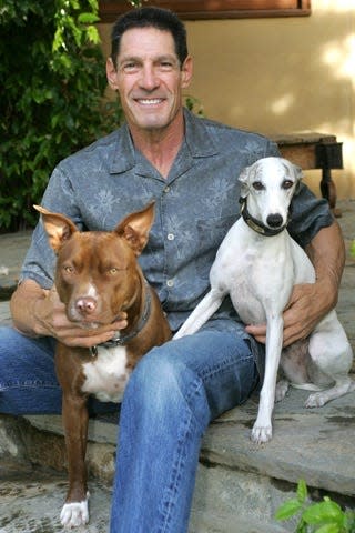 Dr. Michelson with his dogs, Honey and Gracie, in Los Angeles in July 2012.