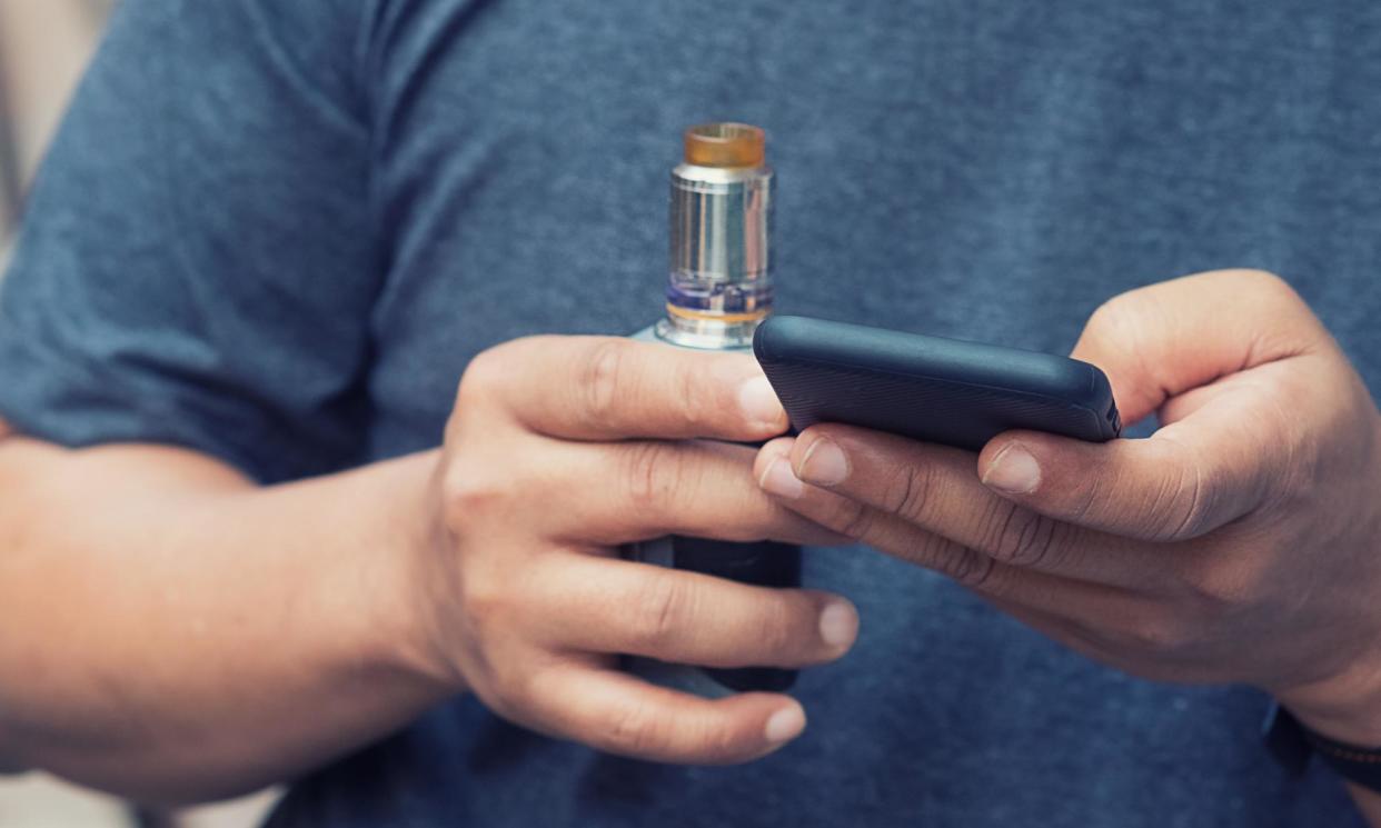 <span>Most e-cigarette posts on TikTok and Instagram portray vape use positively, a study has found.</span><span>Photograph: PrathanChorruangsak/Getty Images</span>