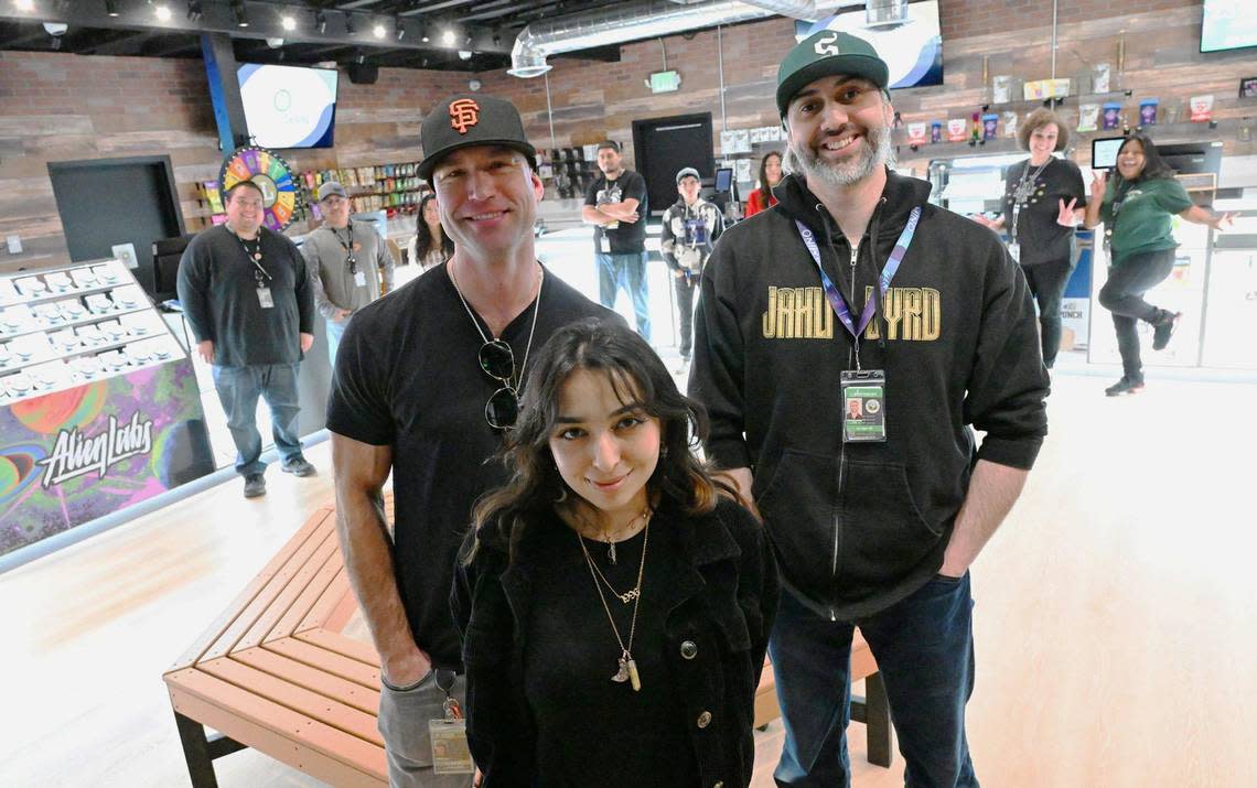 Majority owner Marley Forsyth, front and center, is flanked by Sal Palma, left, and Jordan White, right, with staff behind at Higher Level, Fresno‘s newest cannabis dispensary located on Blackstone Ave. between Gettysburg and Shaw avenues. Photographed Monday, Feb 12, 2024 in Fresno.