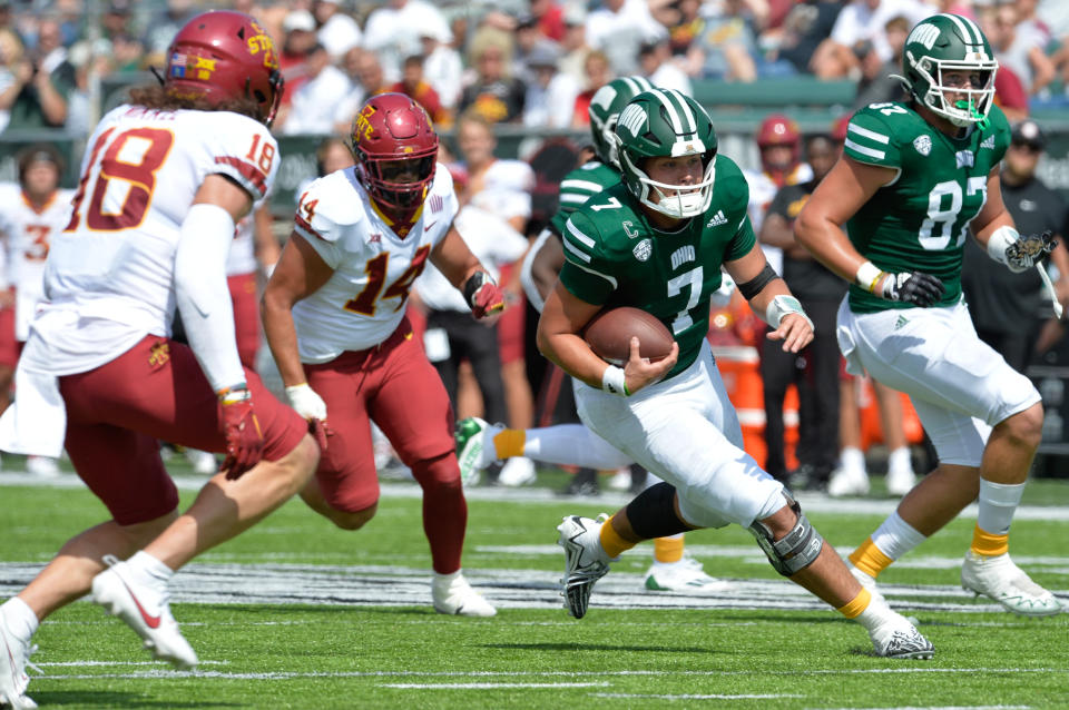 Sept. 16, 2023; Athens, Ohio; Ohio University Bobcats quarterback Kurtis Rourke (7) runs the ball against Iowa State Cyclones defensive back Ben Nikkel (18) and linebacker Carson Willich (14) during the fourth quarter at Peden Stadium. Matt Lunsford-USA TODAY Sports