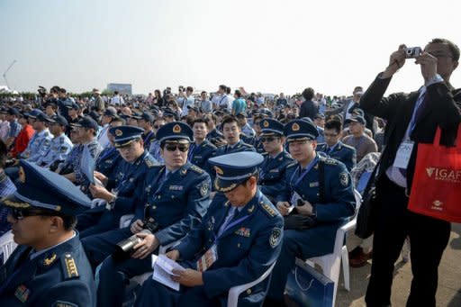 Members of China's Air Force attend the opening of the 9th China International Aviation and Aerospace Exhibition in Zhuhai, on November 13. China's air show comes as the Communist Party holds a meeting to select the country's new leaders -- including the party's Central Military Commission, which controls the armed forces