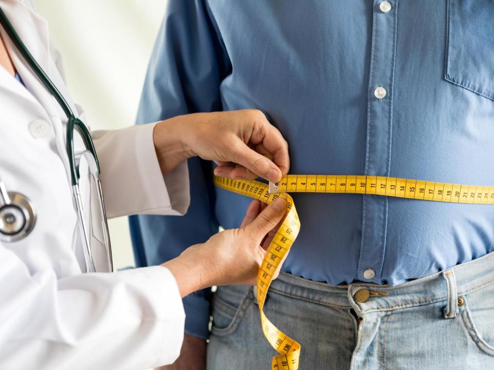 A number of medical experts are calling for obesity to be classed as a disease in order to encourage people to seek treatment.John Wilding, professor of medicine at the institute of ageing and chronic disease at the University of Liverpool, and Vicki Mooney, executive director of the European Coalition for People living with Obesity (EASO), argue that the view obesity is “self-inflicted and that it is the individual’s responsibility to do something about it, is “inaccurate” and reinforces stigma around being overweight.Instead, the pair believe that the role played by genetics combined with the illnesses created by obesity, such as Type 2 diabetes, high blood pressure and some cancers, means it should be defined as a disease.According to the NHS, obesity is thought to affect around one in every four adults in the UK, and roughly one in five children aged 10 to 11.Body mass index (BMI) is widely used as a simple and reliable way of finding out whether a person is a healthy weight for their height.For most adults, the NHS states that having a BMI of 18.5 to 24.9 means you’re considered to be a healthy weight. A person with a BMI of 25 to 29.9 is considered to be overweight, and someone with a BMI over 30 is considered to be obese.Wilding and Mooney add that the Oxford Dictionary supports their argument with its definition of disease as “a disorder of structure or function ... especially one that produces specific symptoms ... and is not simply a direct result of physical injury”.They also state that obesity, in which excess body fat has accumulated to such an extent that health may be adversely affected, has been considered a disease by the World Health Organisation since 1936.“Studies in twins show that 40-70 per cent of the variability in weight is inherited,” Wilding and Mooney write in the British Medical Journal (BMJ) to bolster the theory that obesity is influenced by genetics.“Body weight, fat distribution, and risk of complications are strongly influenced by biology – it is not an individual’s fault if they develop obesity.”The pair add that recognising obesity as a chronic disease with severe complications rather than a lifestyle choice could help “reduce the stigma and discrimination experienced by many people with obesity”.They write: “Instead of discouraging them from seeking treatment it should give them permission to do so.“The stigmatisation of obesity leaves patients fearful of discussing their weight, and they turn to fad diets or non-prescription medication because they assume that their obesity is solely their responsibility.”However, not all medical professionals agree with Wilding and Mooney’s stance on the issue.In contrast, Dr Richard Pile, a GP from St Albans, said the Oxford Dictionary definition of disease “is so vague that we can classify almost anything as a disease”.Also writing in the BMJ, Pile argues that recommending a change implies that current NHS and public health strategies are “doomed to failure without classifying obesity as a disease“.”Labelling obesity as a disease risks reducing autonomy, disempowering and robbing people of the intrinsic motivation that is such an important enabler of change,” Pile adds.“It encourages fatalism, promoting the fallacy that genetics are destiny.”The debate in the BMJ follows calls from the Royal College of Physicians (RCP) in January for the Government and the NHS to urgently recognise obesity as a disease.The RCP said it wanted to see obesity recognised as an ongoing chronic disease to allow the creation of formal healthcare policies to improve care both in doctors’ surgeries and hospitals.It argued that obesity is not a lifestyle choice caused by individual greed “but a disease caused by health inequalities, genetic influences and social factors”.