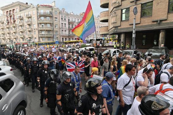 Officers flank marchers on Sunday's Pride Parade in Kiev (Getty)