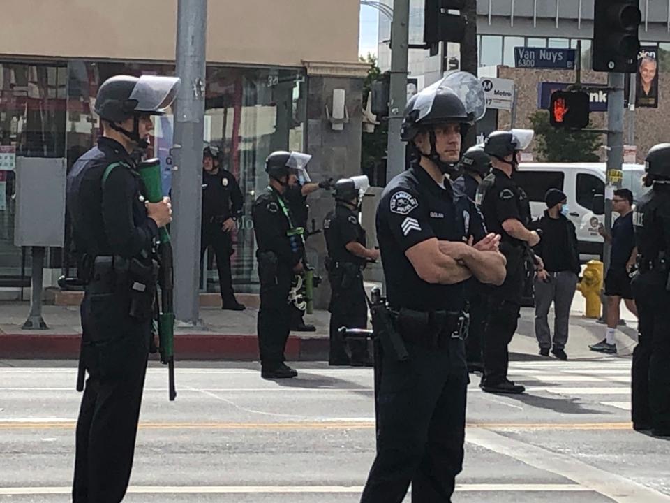 LAPD officers watch a peaceful protest June 1 on Van Nuys Boulevard.