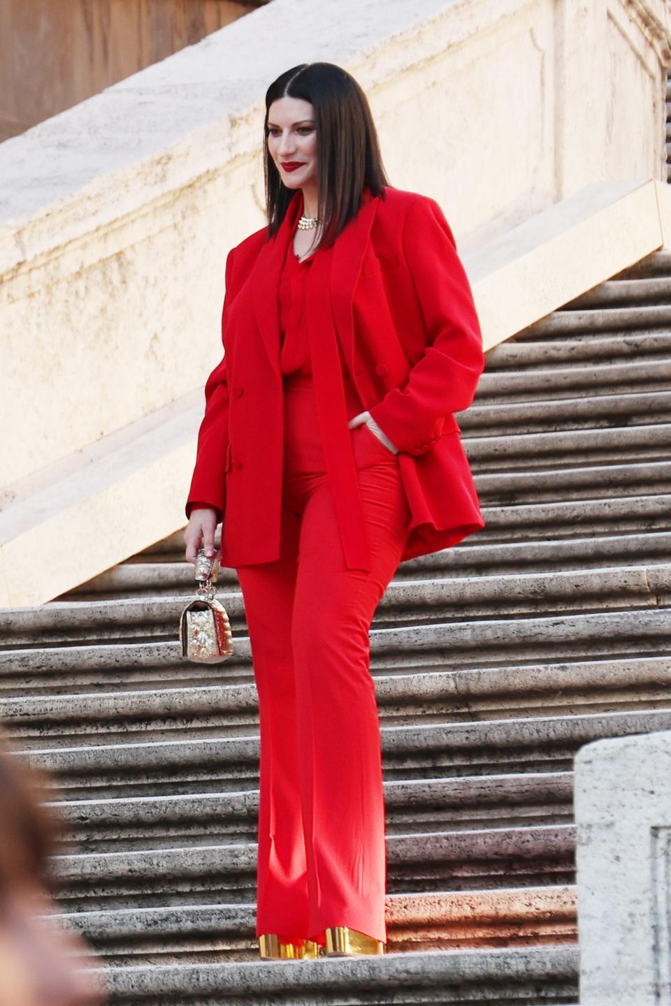 Laura Pausini posing for photos at the Valentino haute couture show in Rome, Italy.