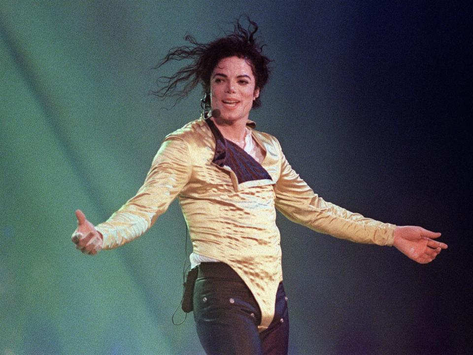 US pop star and entertainer Michael Jackson preforms before an estimated audience of 60,000 in Brunei on July 16, 1996. Michael Jackson died on June 25, 2009 after suffering a cardiac arrest, sending shockwaves sweeping across the world and tributes pouring in on June 26 for the tortured music icon revered as the "King of Pop."