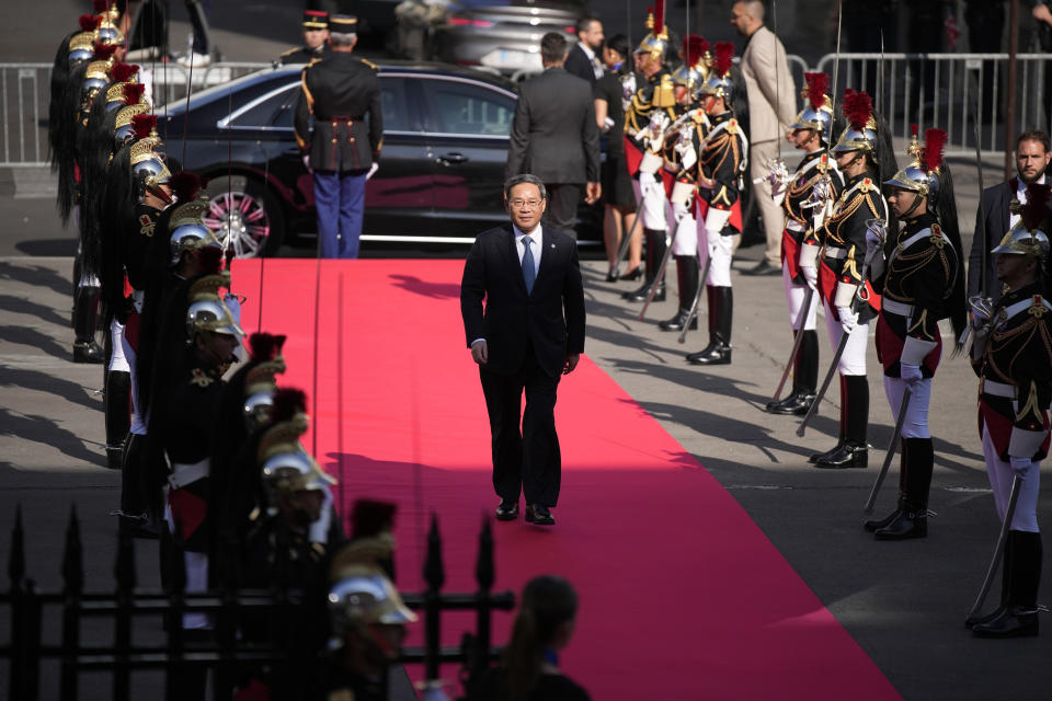 China's Prime Minister Li Qiang arrives for the closing session of the New Global Financial Pact Summit, Friday, June 23, 2023 in Paris. The aim of the two-day climate and finance summit was to set up concrete measures to help poor and developing countries whose predicaments have been worsened by the devastating effects of the COVID-19 pandemic and the war in Ukraine better tackle poverty and climate change. (AP Photo/Lewis Joly, Pool)