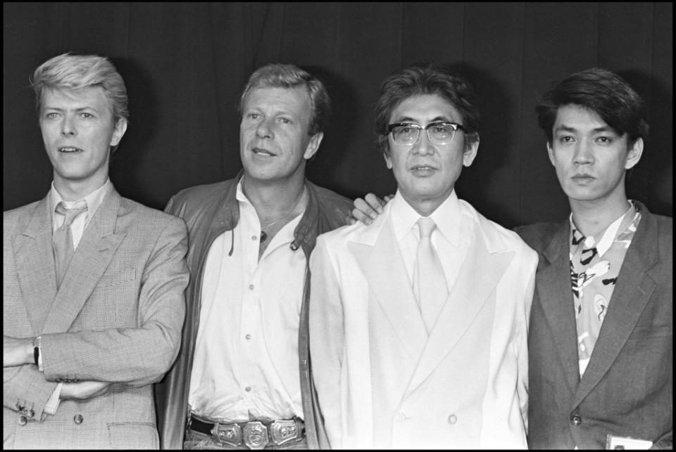 David Bowie, Nagisa Oshima and Ryuichi Sakamoto presentent Furyo at 1983 International Cannes Film Festival . (Photo by Bertrand Rindoff Petroff/Getty Images)