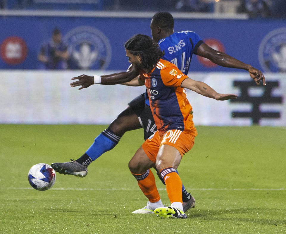 New York City FC's Justin Haak, front, and CF Montreal's Sunusi Ibrahim vie for the ball during the first half of an MLS soccer match Saturday, July 1, 2023, in Montreal. (Peter McCabe/The Canadian Press via AP)