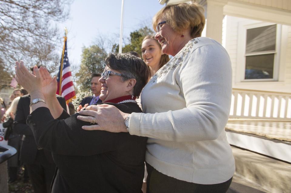 From left: Carol Schall and Mary Townley celebrate Thursday's ruling by federal Judge Arenda Wright Allen that Virginia's same-sex marriage ban was unconstitutional during a news conference, Friday, Feb. 14, 2014 in Norfolk, Va. Wright Allen on Thursday issued a stay of her order while it is appealed, meaning that gay couples in Virginia still won’t be able to marry until the case is ultimately resolved. An appeal will be filed to the 4th District Court of Appeals, which could uphold the ban or side with Wright Allen. (AP Photo/The Virginian-Pilot, Bill Tiernan) MAGS OUT