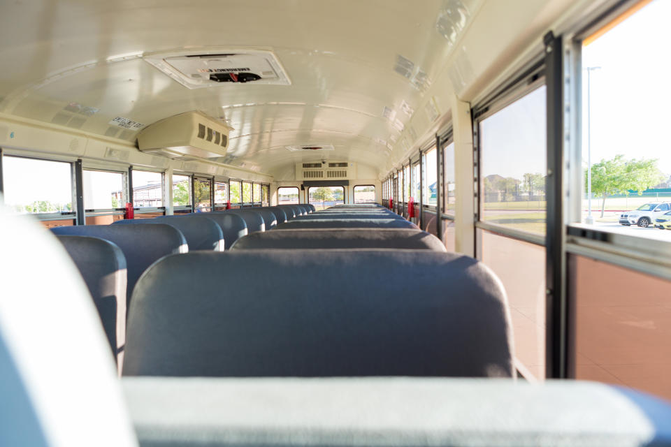 The seventh grader came home with the note in his backpack. Pictured is a stock image of a school bus's interior.