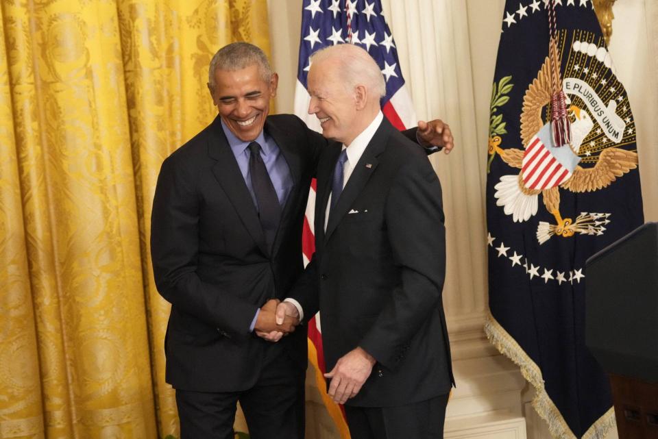 Barack Obama and Joe Biden shaking hands