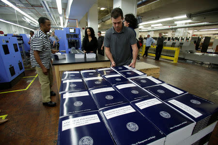 Workers prepare for delivery printed President Donald Trump's FY2018 budget at the Government Publishing Office in Washington, U.S., May 19, 2017. REUTERS/Yuri Gripas