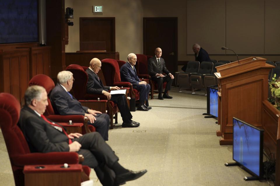 In this photograph provided by The Church of Jesus Christ of Latter-day Saints shows, left to right, Neil L. Andersen, M. Russell Ballard, both members of a top governing board called the Quorum of the Twelve Apostles, counselor, Dallin H. Oaks, President Russell M. Nelson and counselor Henry B. Eyring during The Church of Jesus Christ of Latter-day Saints' twice-annual church conference Saturday, April 4, 2020, in Salt Lake City. The conference kicked off Saturday without anyone attending in person and top leaders sitting some 6 feet apart inside an empty room as the faith takes precautions to avoid the spread of the coronavirus. A livestream of the conference showed a few of the faith's top leaders sitting alone inside a small auditorium in Salt Lake City, Normally, top leaders sit side-by-side on stage with the religion's well-known choir behind them and some 20,000 people watching. (The Church of Jesus Christ of Latter-day Saints via AP)