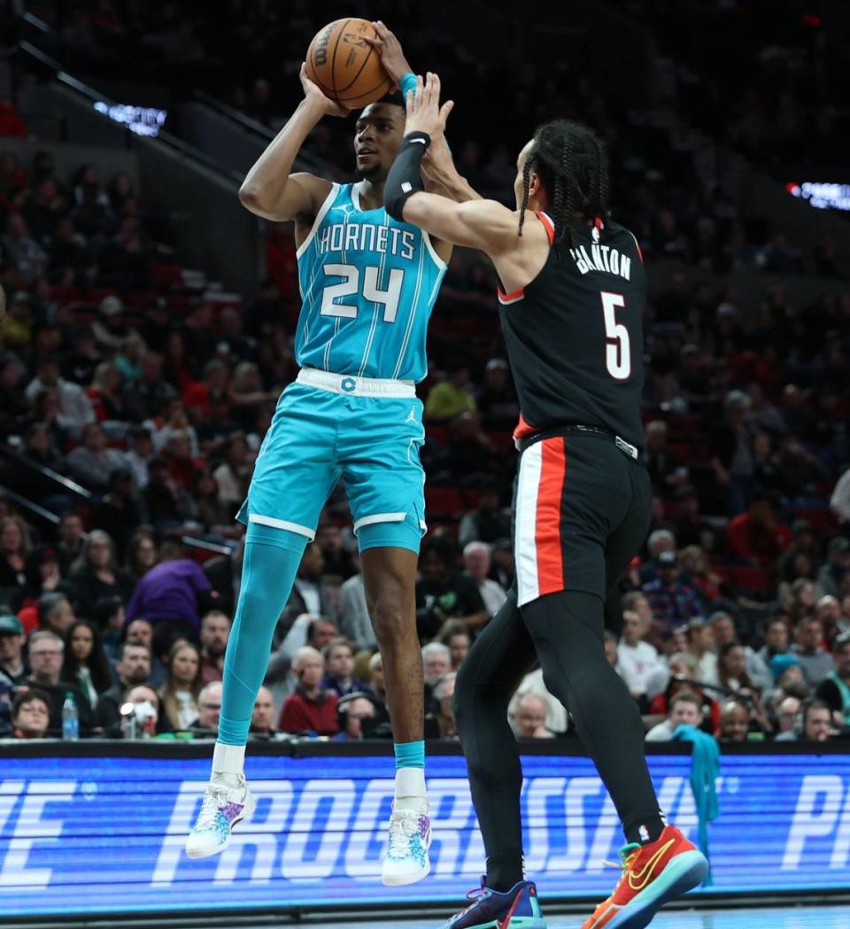 Charlotte Hornets forward Brandon Miller (24) shoots the ball over Portland Trail Blazers guard Dalano Banton (5) in the second quarter at Moda Center.