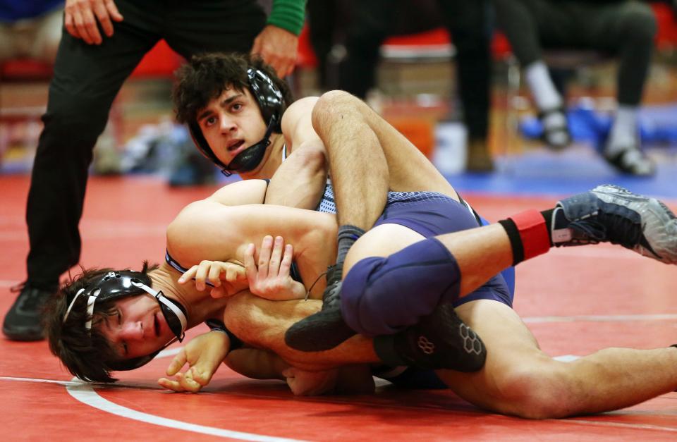Pearl River's Michael Malfitano and Suffern's Maxim Kochergin wrestle in the 152-pound weight class during the Rockland County wrestling championship at Tappan Zee High School Jan. 21, 2023. Malfitano won the match.