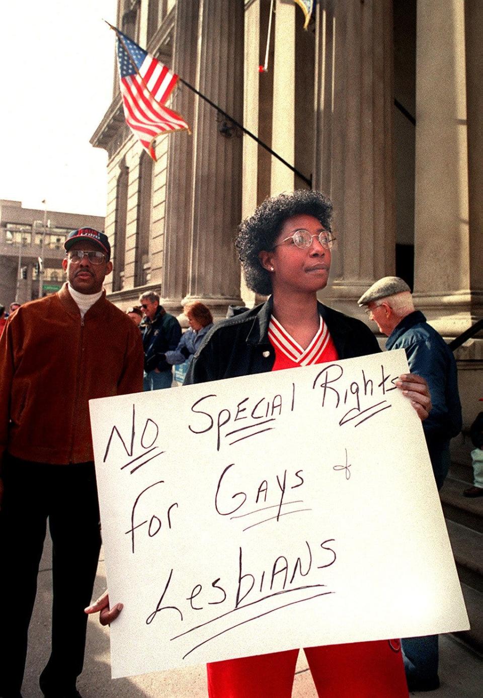 Jan. 19, 1999 Joey Stephenson held a sign during a protest outside City Hall of a proposed Fairness Amendment for the city. She is the sister of one of one of the main organizers, pastor Jerry Stephenson.