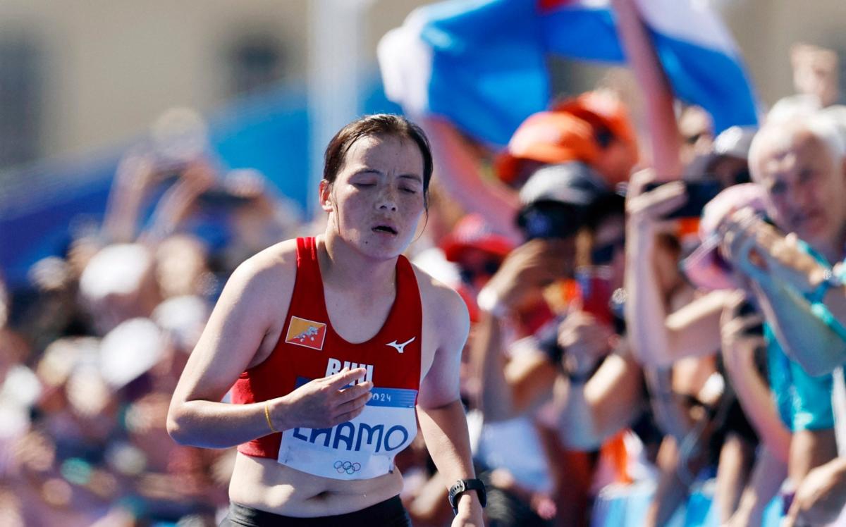 The ‘Pied Piper of Bhutan’: Kinzang Lhamo walks to finish line with huge crowd cheering her on