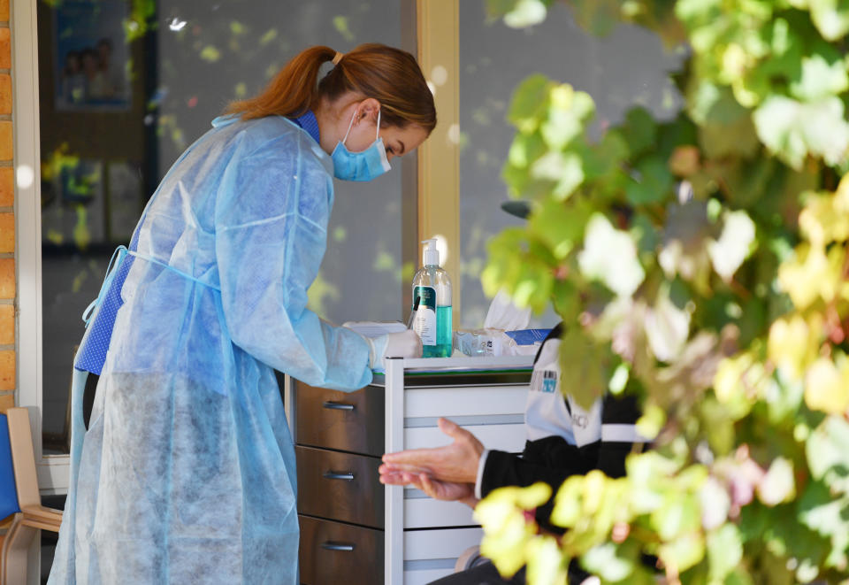 A nurse at the Tanunda medical centre screens patients outside the clinic in the Barossa Valley. Source: AAP