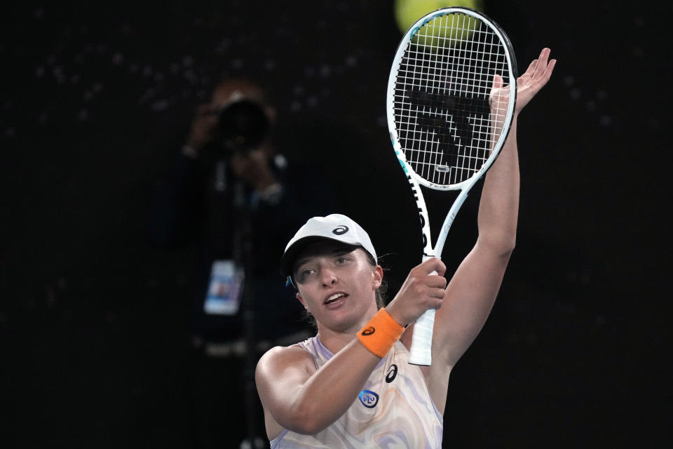 Iga Swiatek of Poland celebrates after defeating Camila Osorio of Colombia in their second round match at the Australian Open tennis championship in Melbourne, Australia, Wednesday, Jan. 18, 2023. (AP Photo/Dita Alangkara)