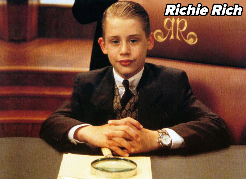 Macaulay sitting at a table in Richie Rich
