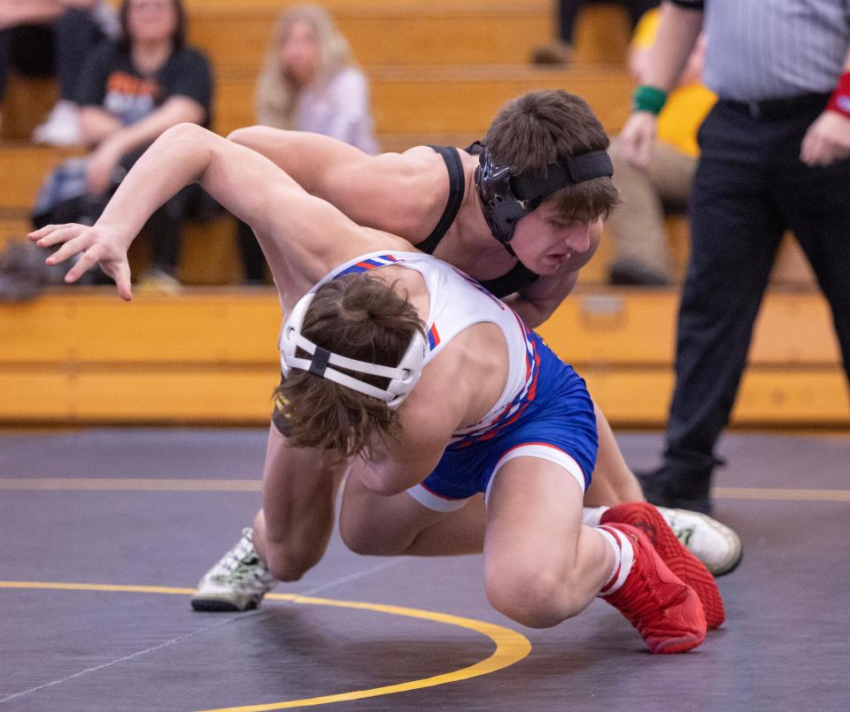 Mason Rohr of Perry takes down Lake's Peyton Lovell in their 126-pound matchup, Thursday, Jan. 25, 2024.