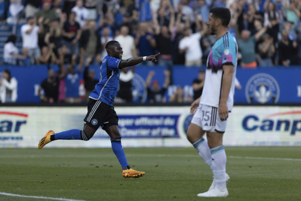 CF Montreal defender Zachary Brault-Guillard, left, celebrates after a goal against Minnesota United during first-half MLS soccer match action in Montreal, Saturday, June 10, 2023. (Evan Buhler/The Canadian Press via AP)