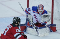 New York Rangers goaltender Alexandar Georgiev defends the goal during the second period of the NHL hockey game against the New Jersey Devils in Newark, N.J., Sunday, April 18, 2021. (AP Photo/Seth Wenig)