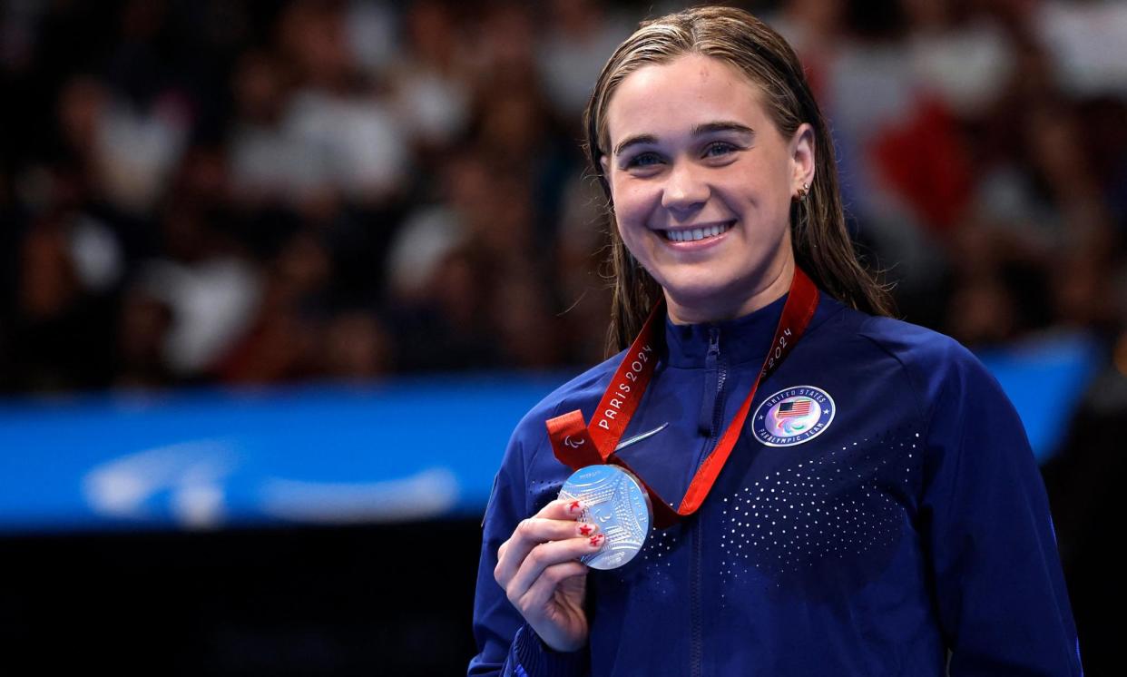 <span>Ali Truwit receives her silver medal after the S10 400m freestyle.</span><span>Photograph: Andrew Couldridge/Reuters</span>