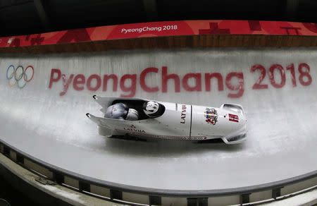 Bobsleigh - Pyeongchang 2018 Winter Olympics - Men's 2-man Finals - Olympic Sliding Centre - Pyeongchang, South Korea - February 19, 2018 - Oskars Melbardis and Janis Strenga of Latvia. REUTERS/Arnd Wiegmann