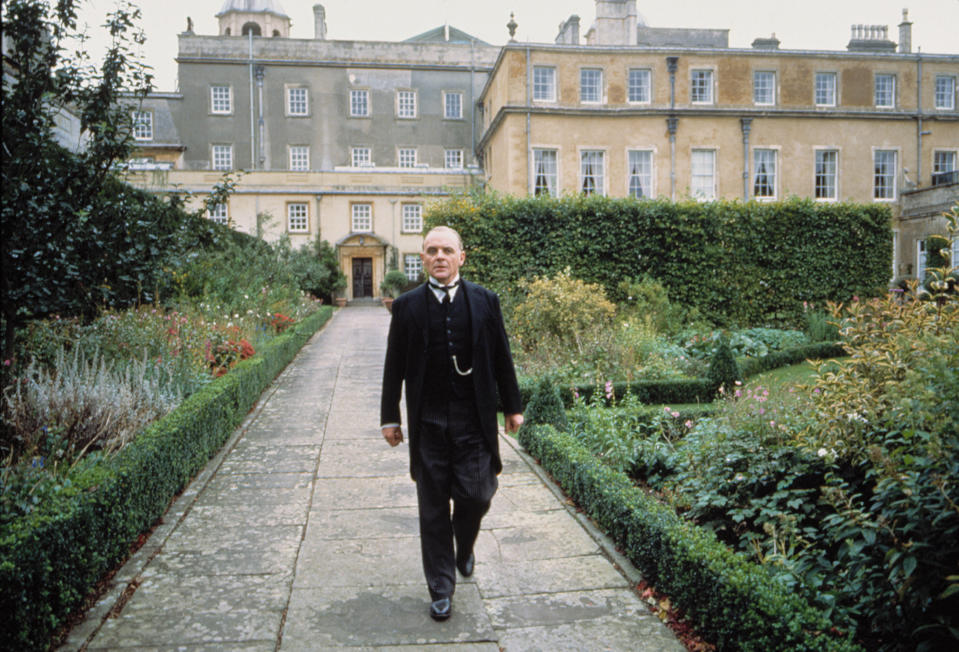 Anthony Hopkins walks through a garden
