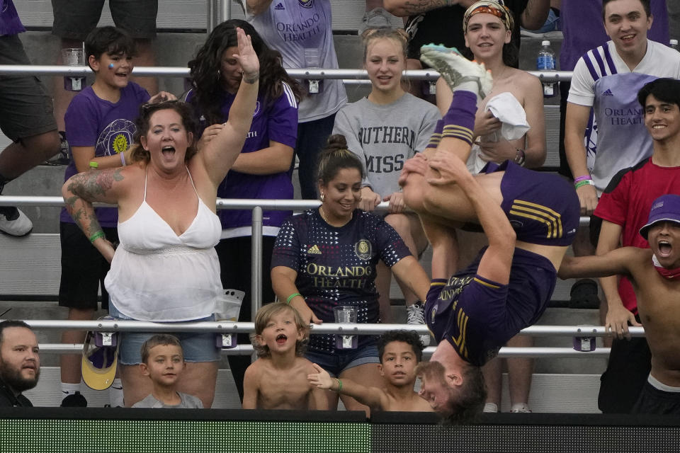 Orlando City's Duncan McGuire, right, does a back flip after scoring a goal against Toronto FC during the first half of an MLS soccer match Tuesday, July 4, 2023, in Orlando, Fla. (AP Photo/John Raoux)