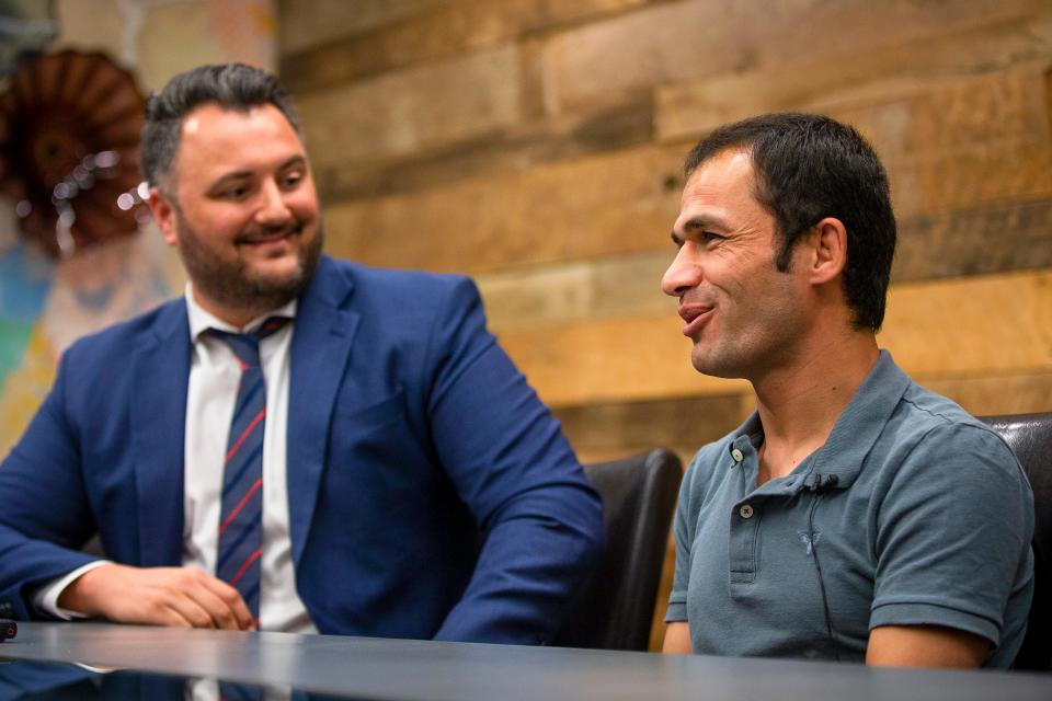 Zabi (right), an Afghan interpreter, and Darius Amiri, an immigration attorney, speak during a news conference at the Rose Law Group in Scottsdale on Oct. 26, 2021.